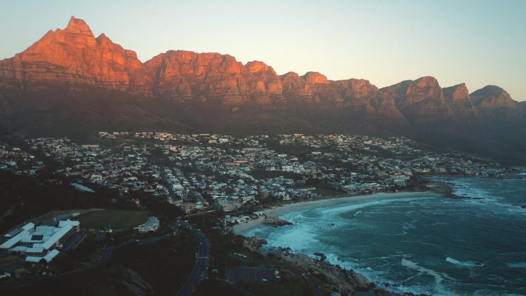 pexels-photo-4873257 A breathtaking view of Cape Town's coastline with the iconic Twelve Apostles mountain range at sunset.